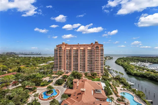 an aerial view of a house with a lake view and a garden