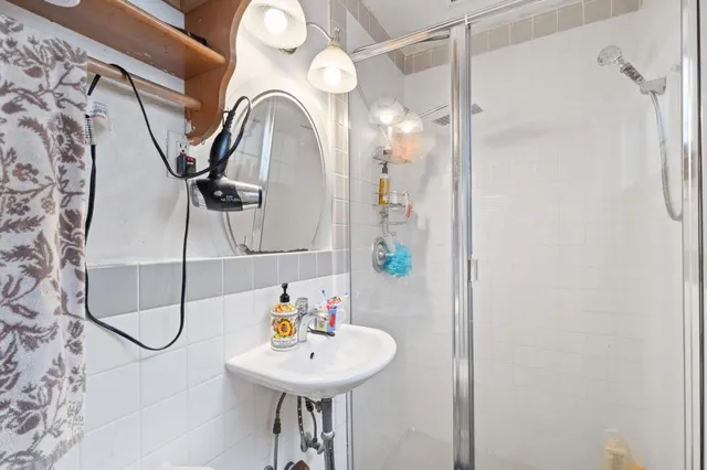 a bathroom with a sink and mirror