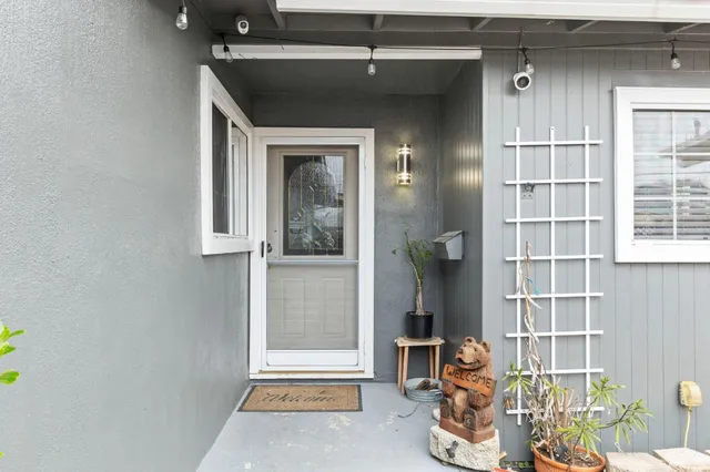 a room with wooden door and glass door