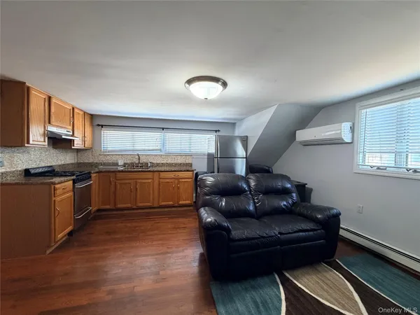 a kitchen with a sink cabinets and window