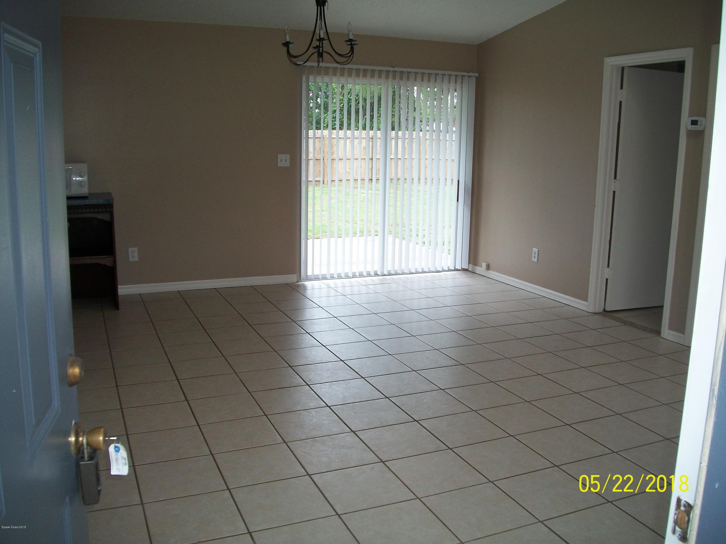 4910 Greenhill Street Cocoa, FL 32927 - Photo 4 of 11 an empty room with windows