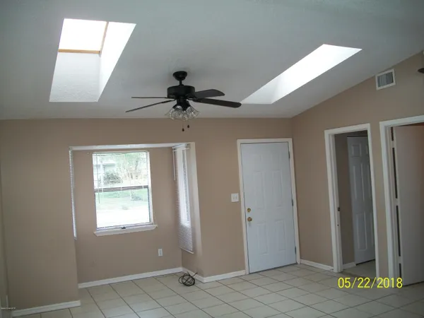 a view of empty room with windows