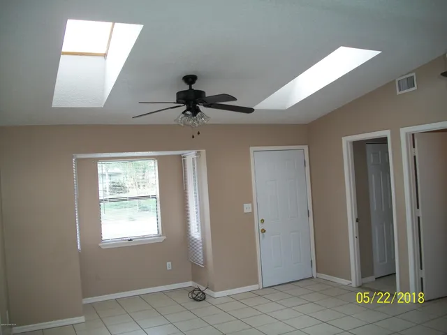 a view of empty room with windows