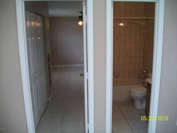a bathroom with a granite countertop toilet