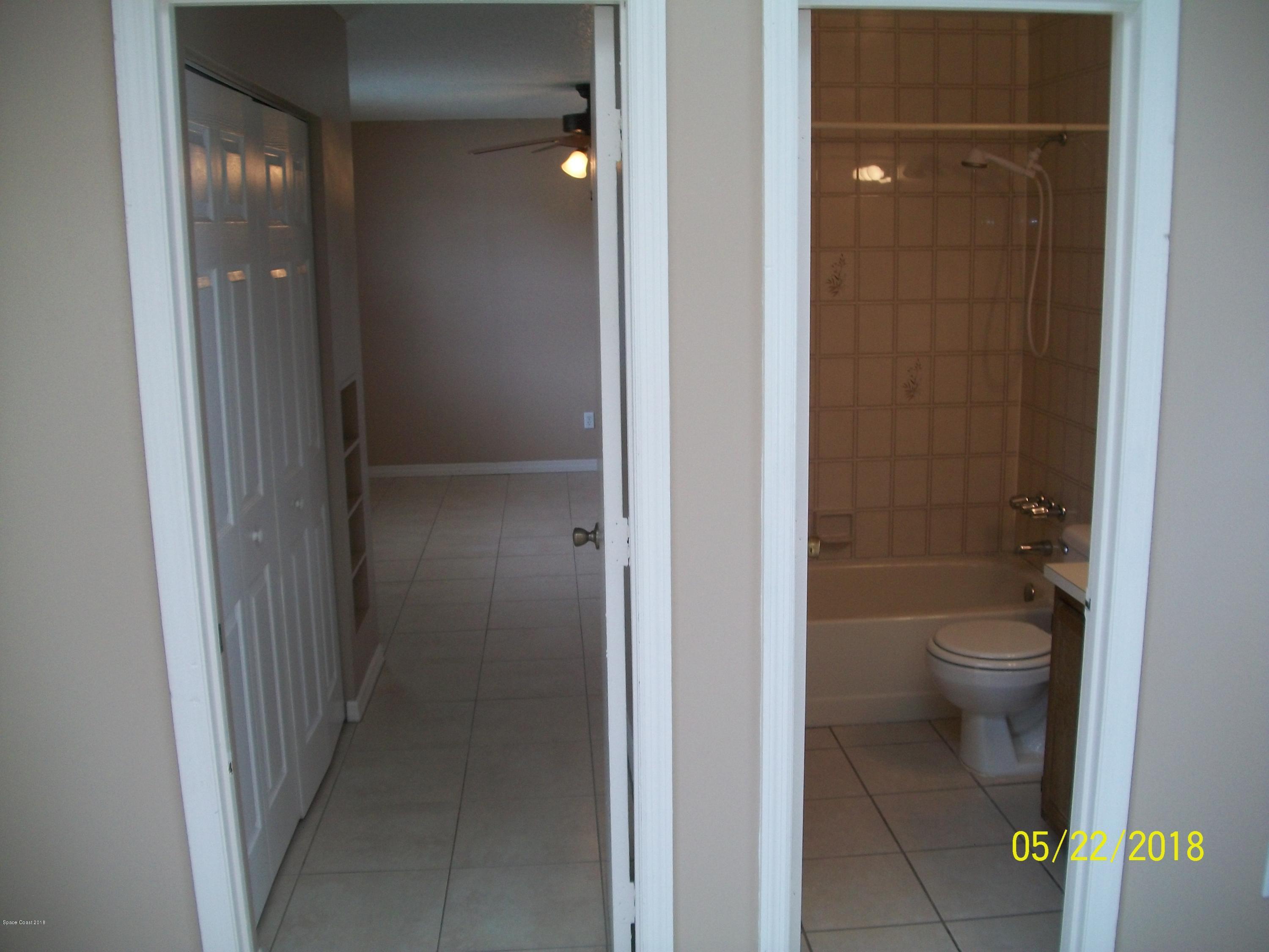 4910 Greenhill Street Cocoa, FL 32927 - Photo 7 of 11 a bathroom with a granite countertop toilet