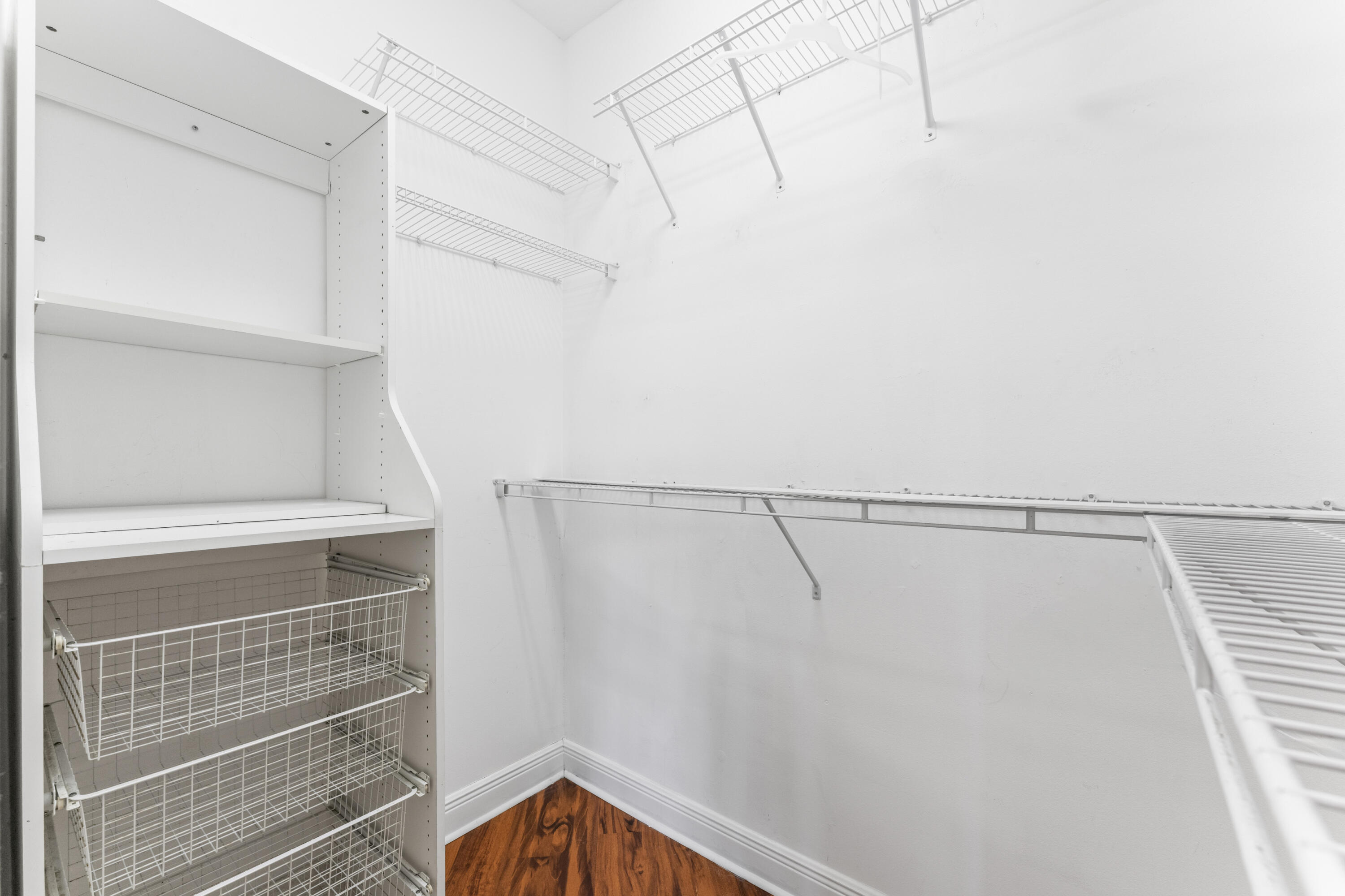 918 Southwest Blue Stem Way Stuart, FL 34997 - Photo 22 of 48 a view of a room with racks on the wall