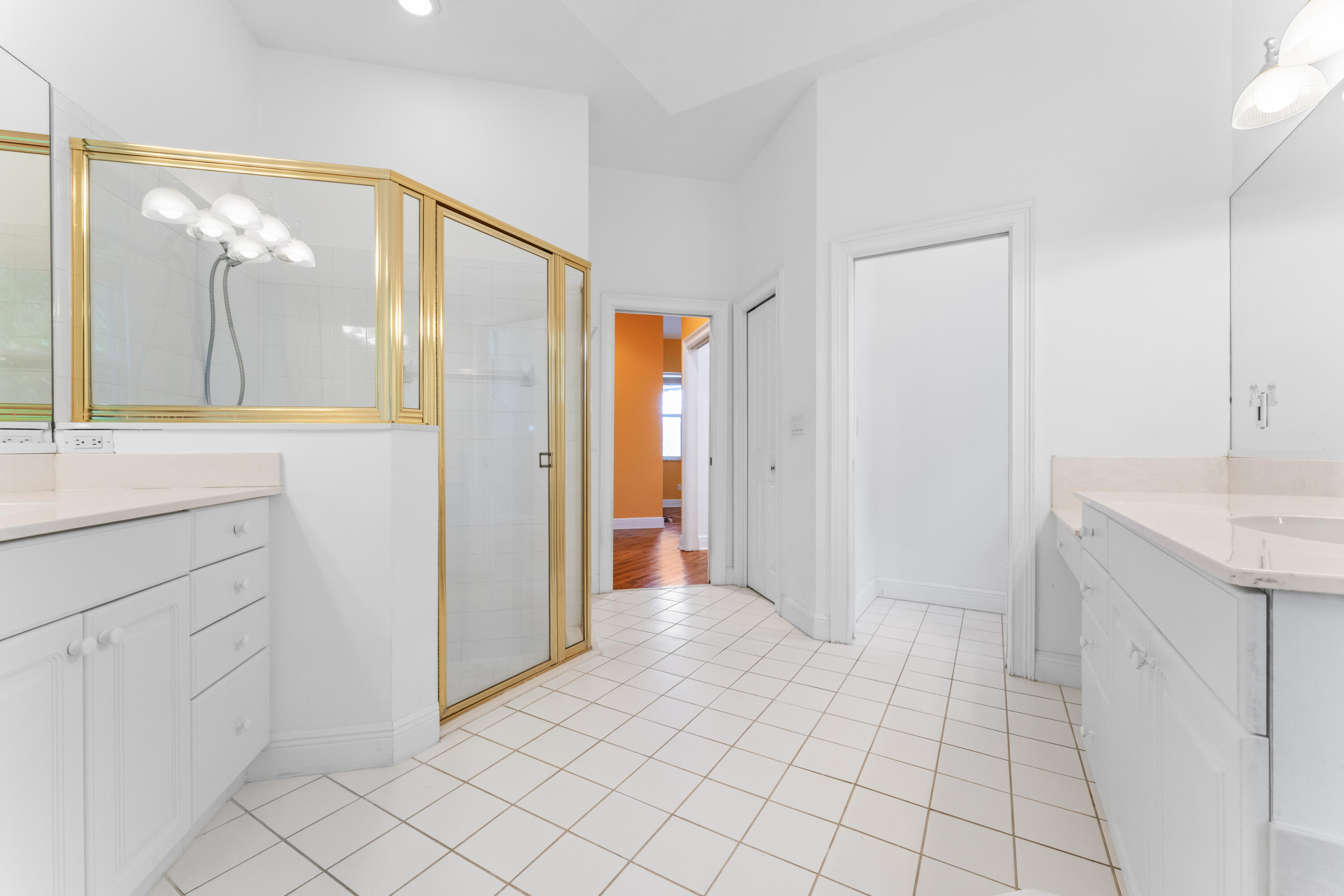 918 Southwest Blue Stem Way Stuart, FL 34997 - Photo 25 of 48 a view of a bathroom with a sink and a mirror