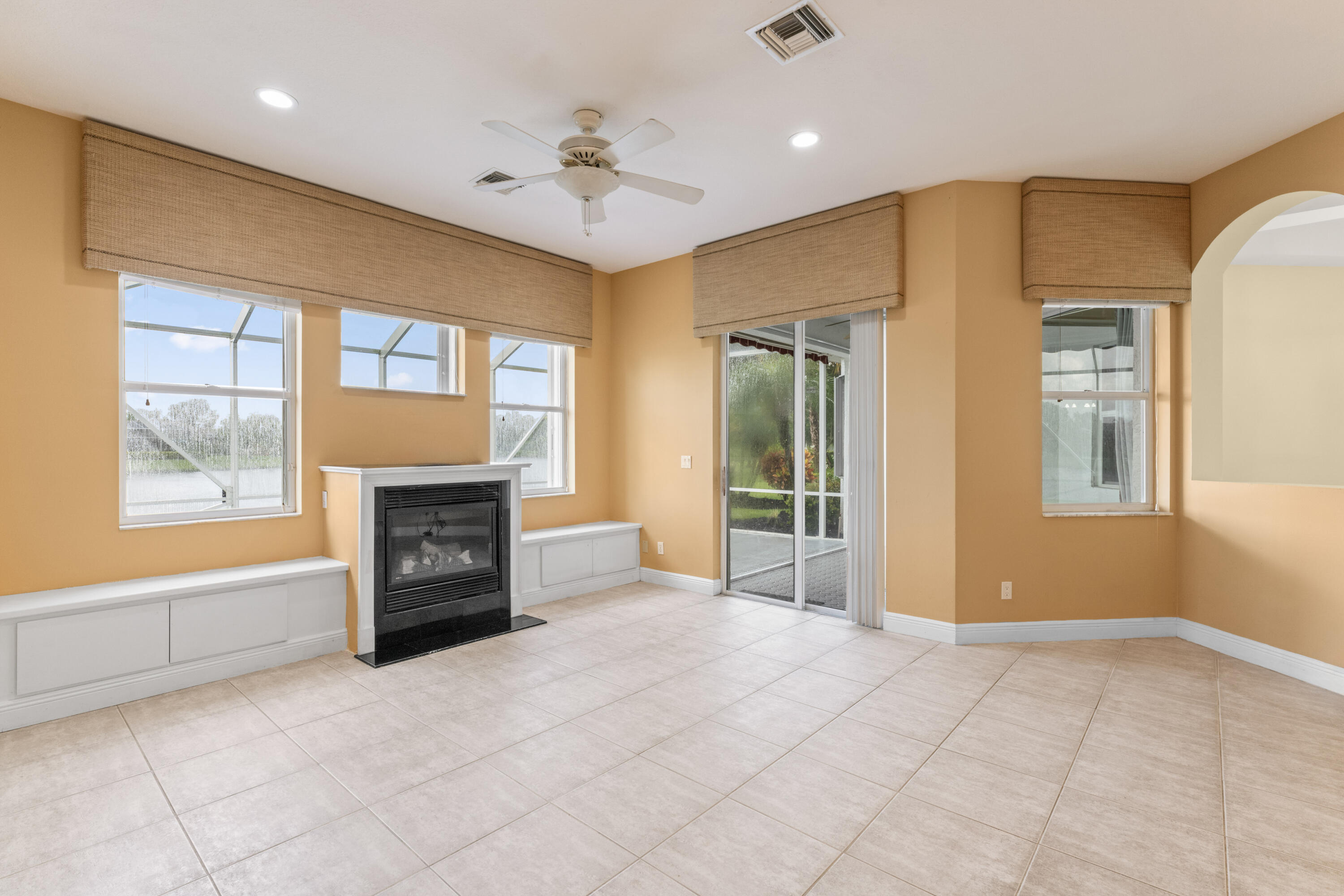 918 Southwest Blue Stem Way Stuart, FL 34997 - Photo 30 of 48 a view of an empty room with a fireplace and a window