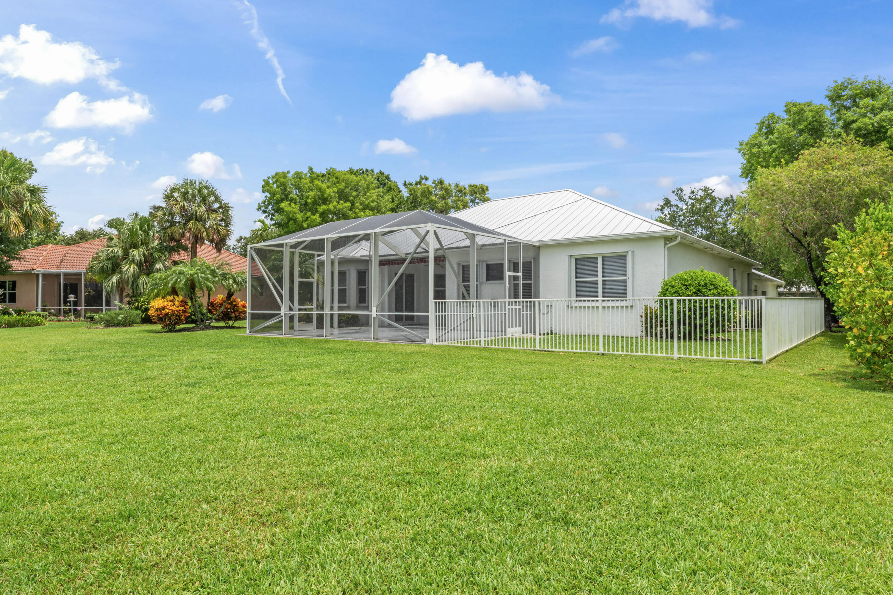 918 Southwest Blue Stem Way Stuart, FL 34997 - Photo 39 of 48 a view of a house with a backyard