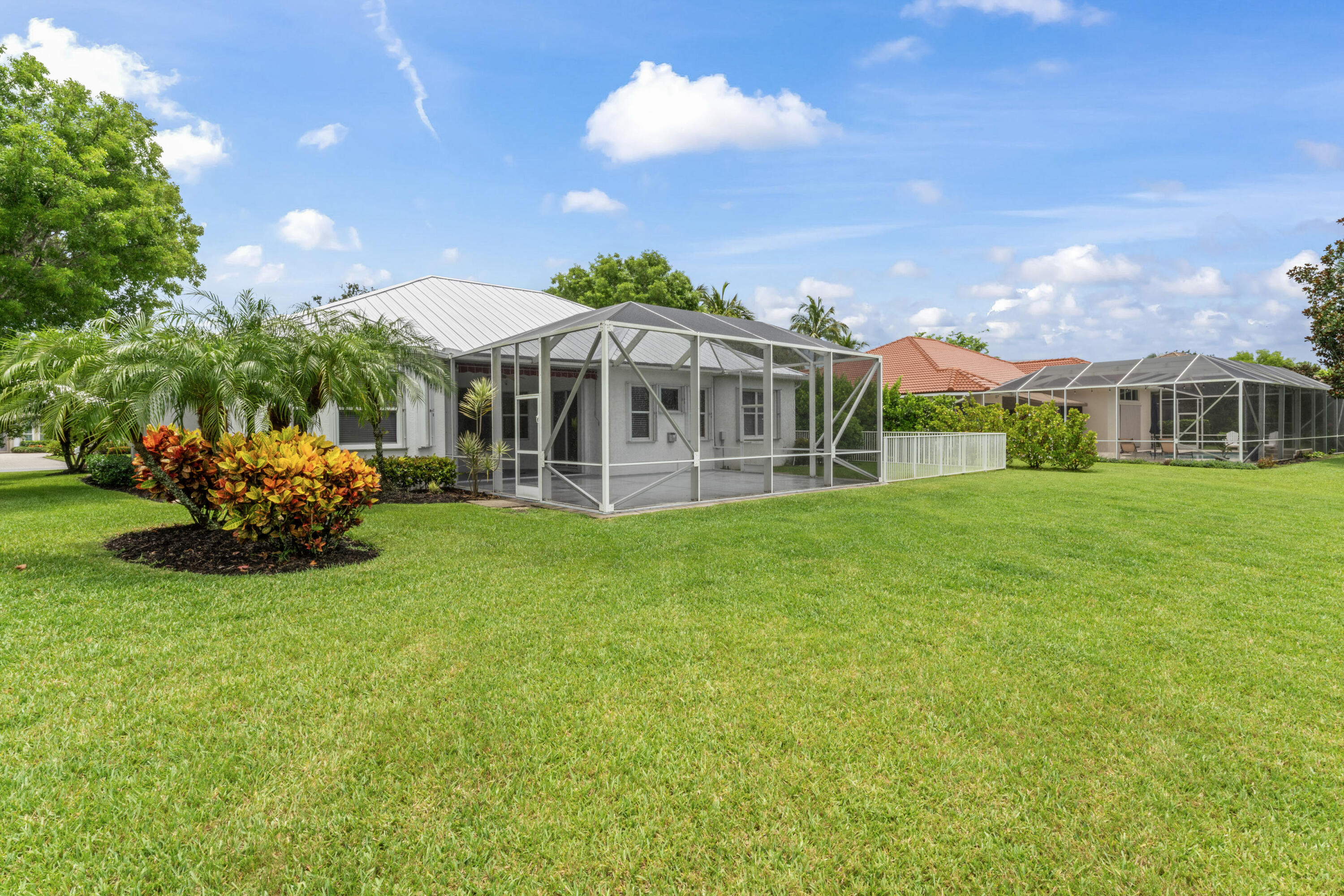918 Southwest Blue Stem Way Stuart, FL 34997 - Photo 40 of 48 a front view of a house with a garden