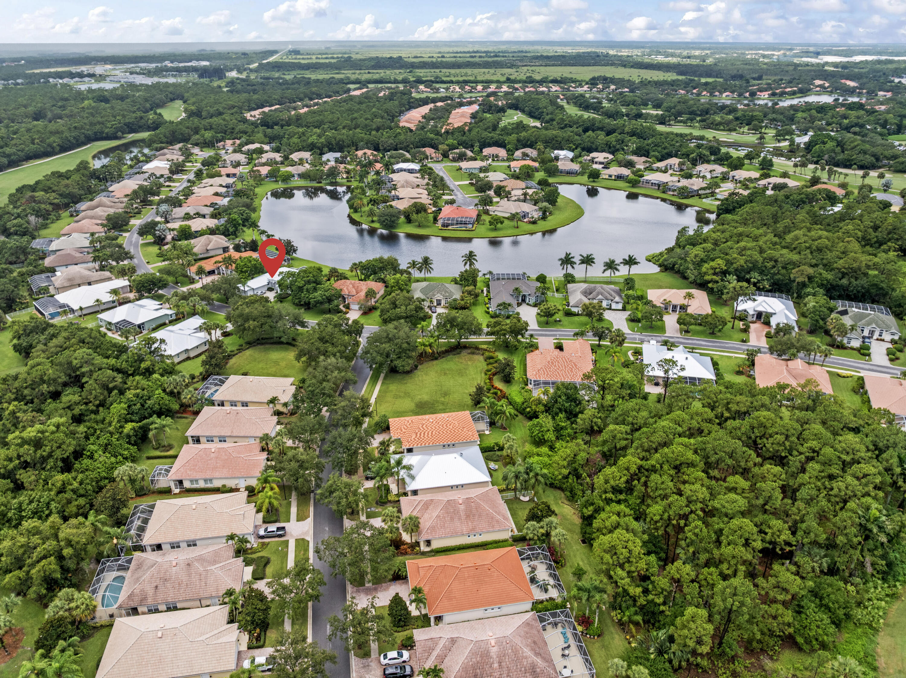 918 Southwest Blue Stem Way Stuart, FL 34997 - Photo 44 of 48 an aerial view of residential houses with outdoor space