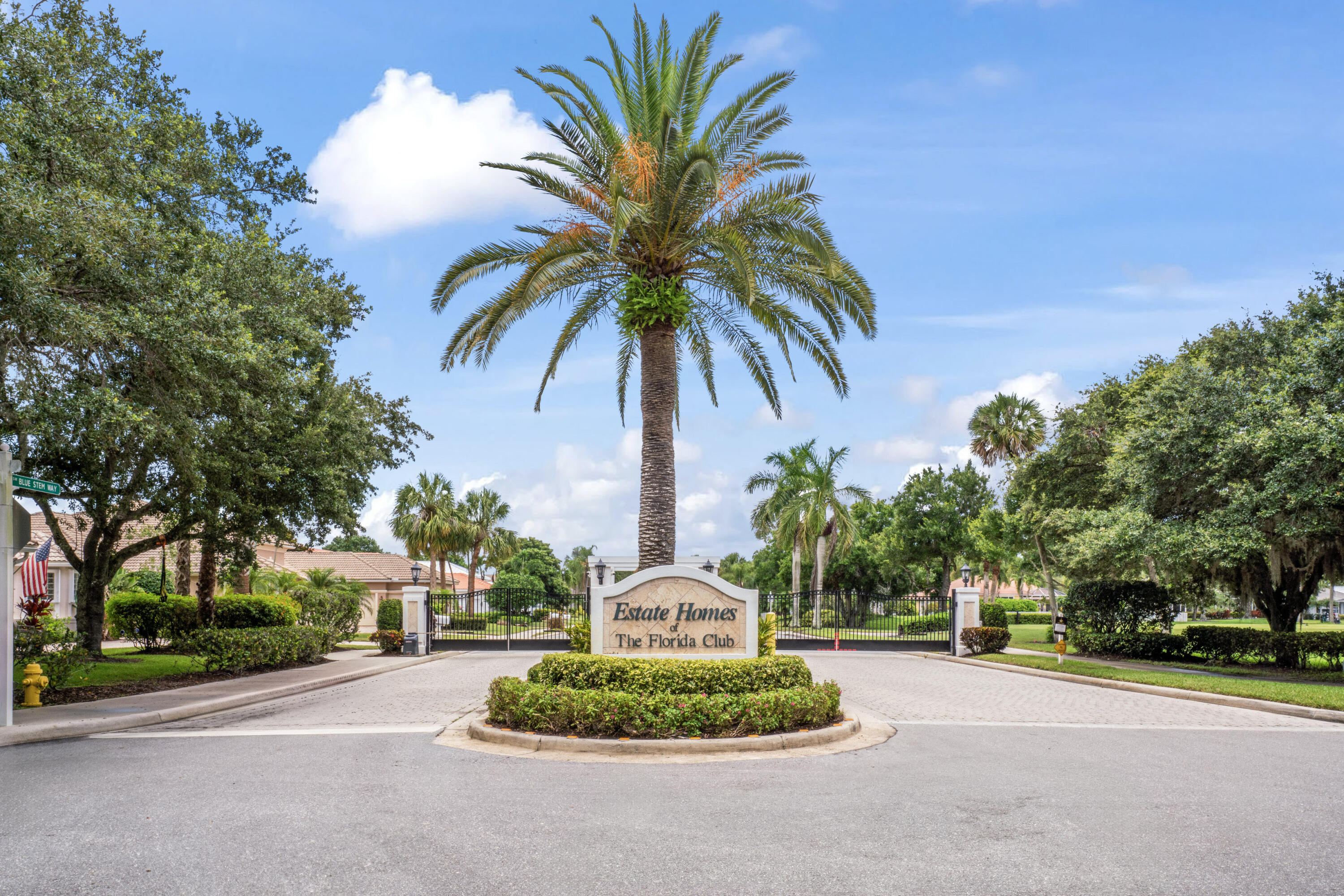 918 Southwest Blue Stem Way Stuart, FL 34997 - Photo 46 of 48 a front view of a house with garden and trees
