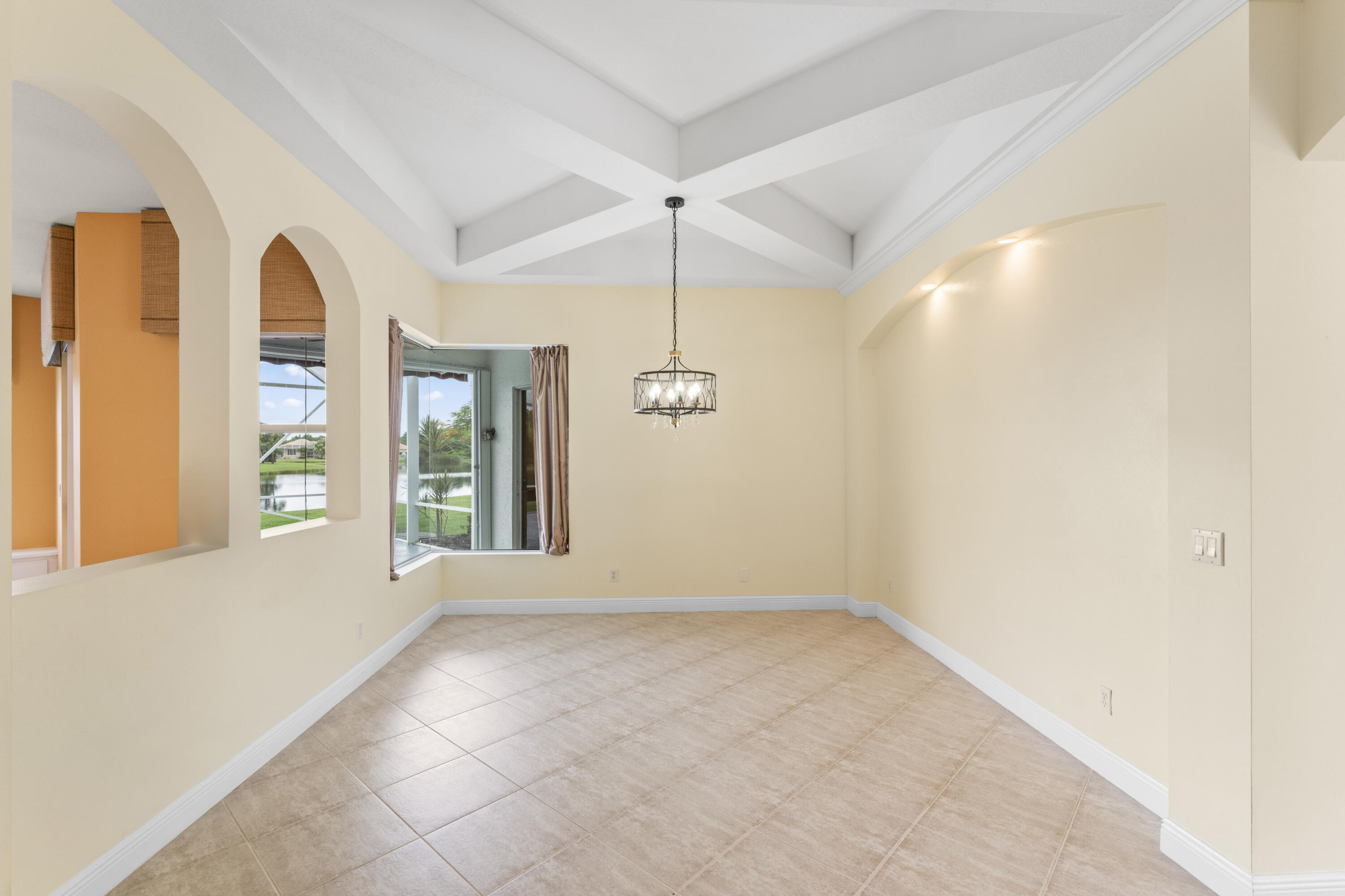 918 Southwest Blue Stem Way Stuart, FL 34997 - Photo 6 of 48 a view of an empty room with a window