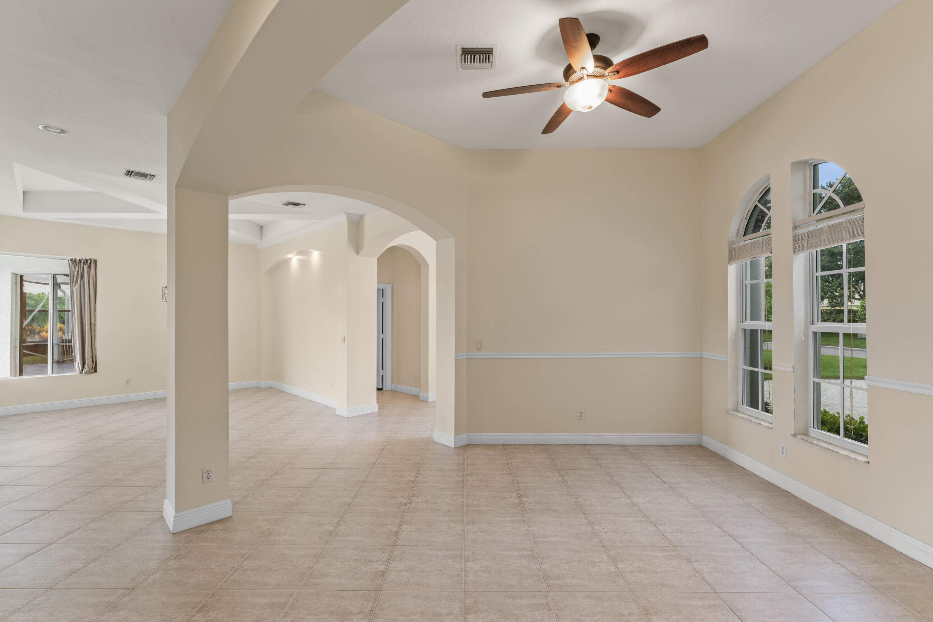918 Southwest Blue Stem Way Stuart, FL 34997 - Photo 8 of 48 wooden floor in an empty room with a window