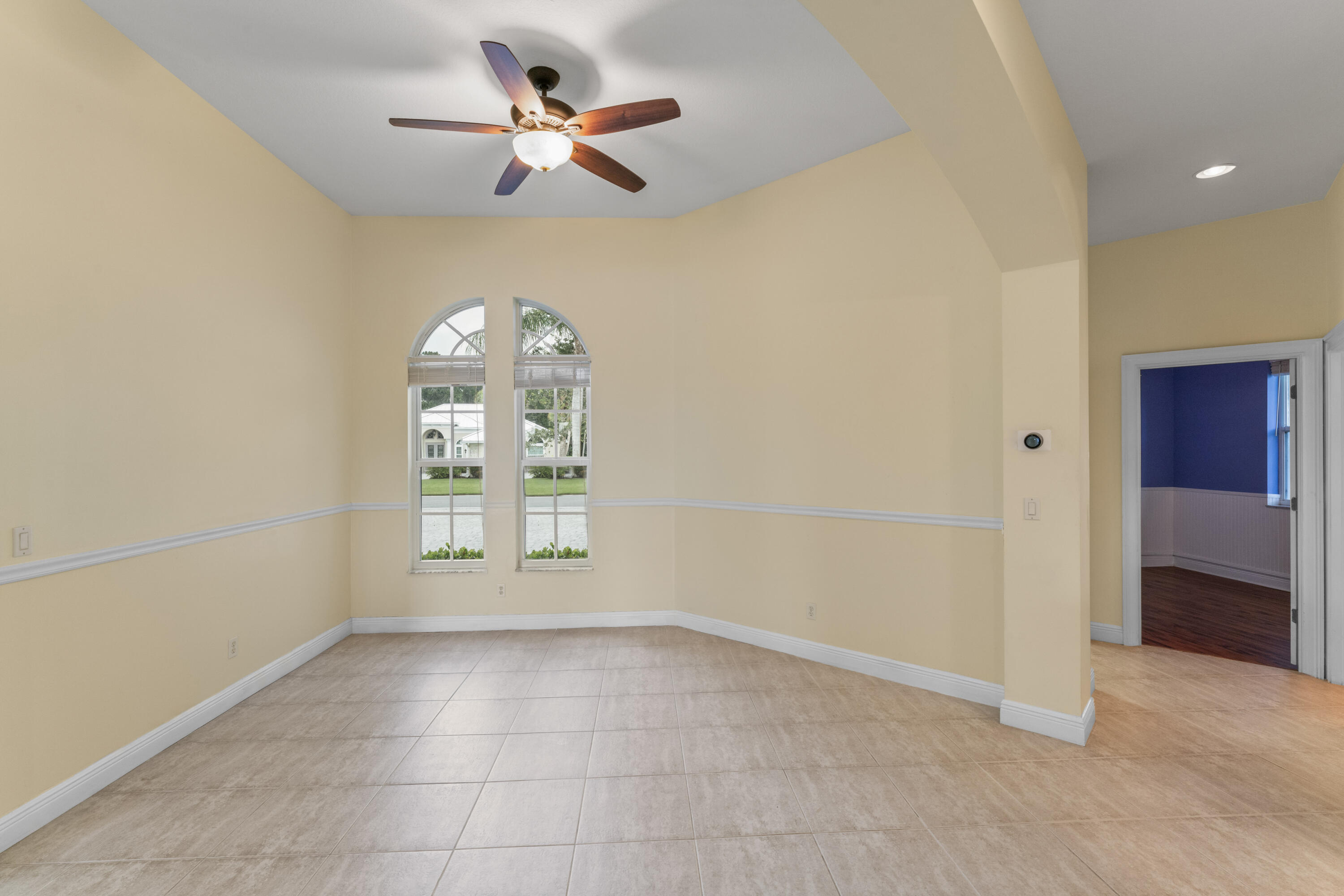 918 Southwest Blue Stem Way Stuart, FL 34997 - Photo 9 of 48 a view of an empty room with a window