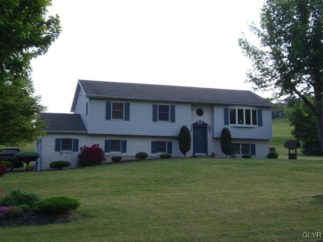 803 Copella Road Bath, PA 18014 - Photo 1 of 31 a front view of the house with garden