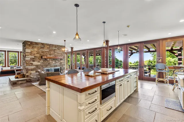 a kitchen with stainless steel appliances granite countertop a stove and more cabinets