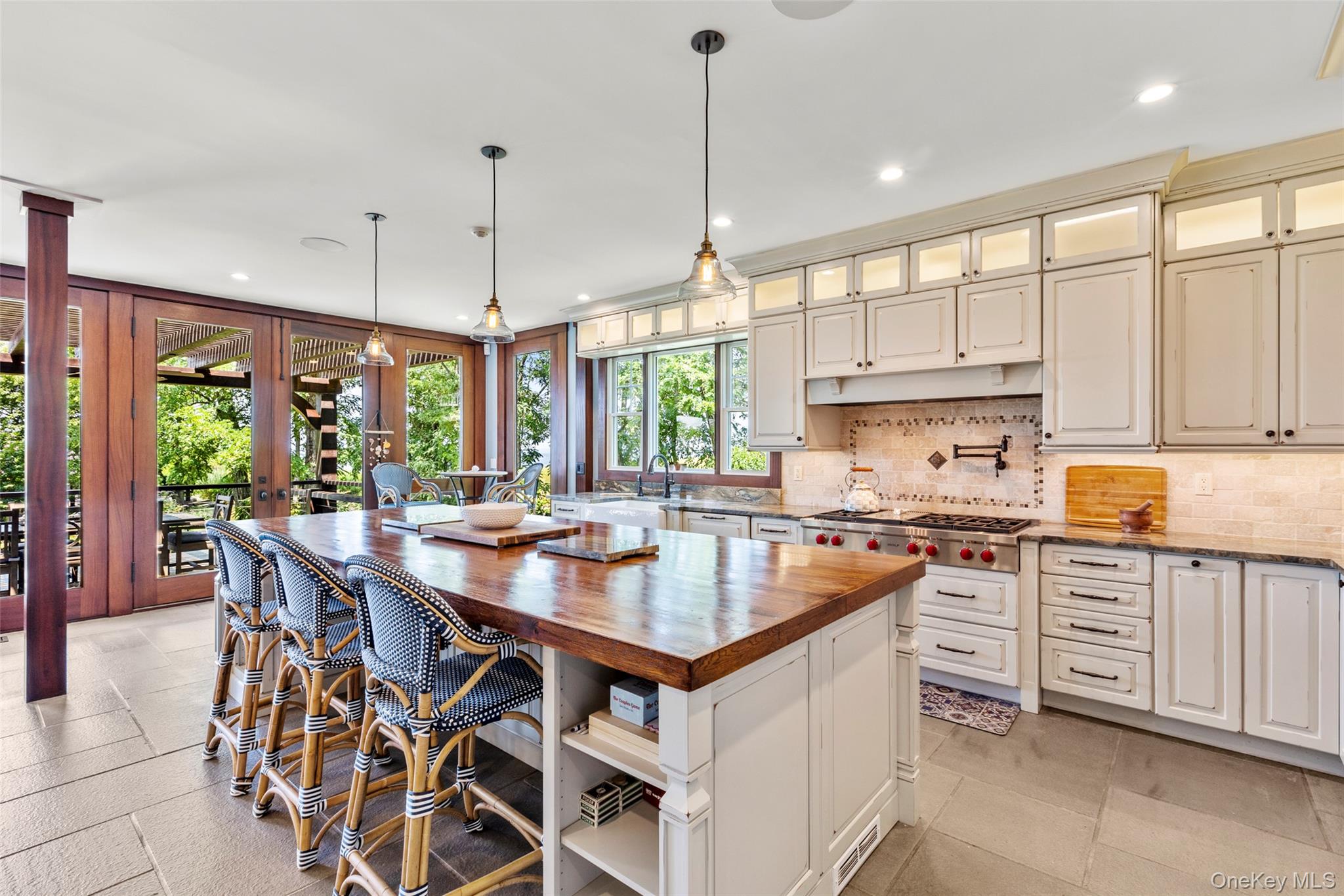 16 Old Field Woods Road Setauket, NY 11733 - Photo 12 of 37 a kitchen with stainless steel appliances granite countertop a stove a sink and a refrigerator