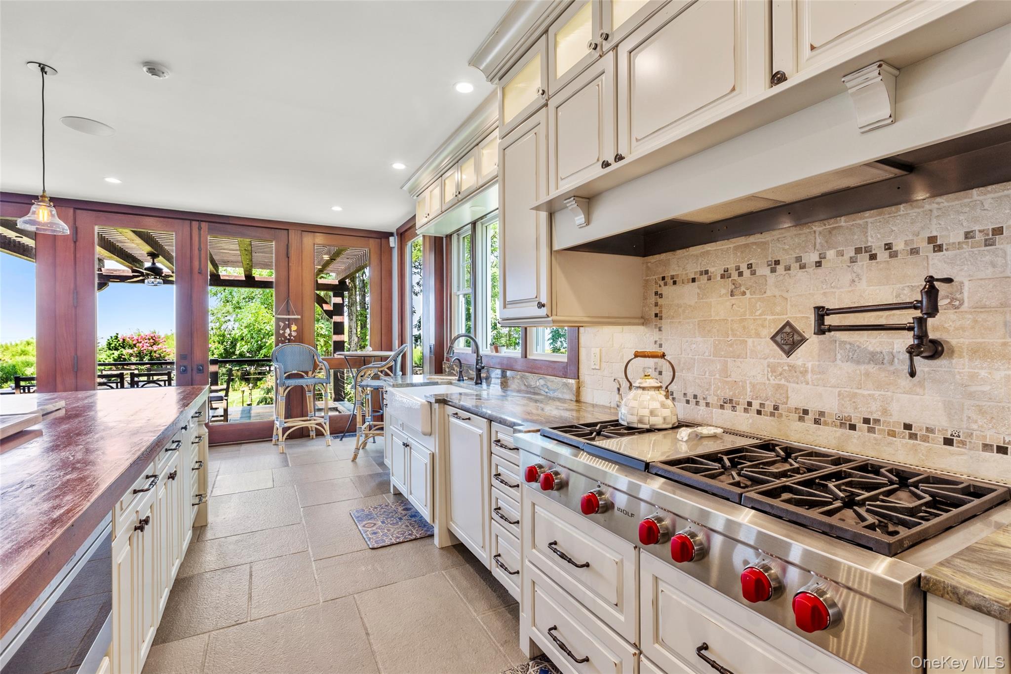 16 Old Field Woods Road Setauket, NY 11733 - Photo 13 of 37 a kitchen with stove a sink and cabinets