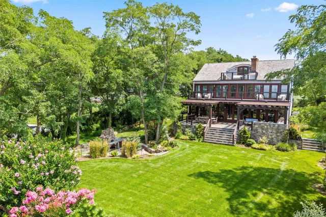 a view of a house with a yard patio and sitting area