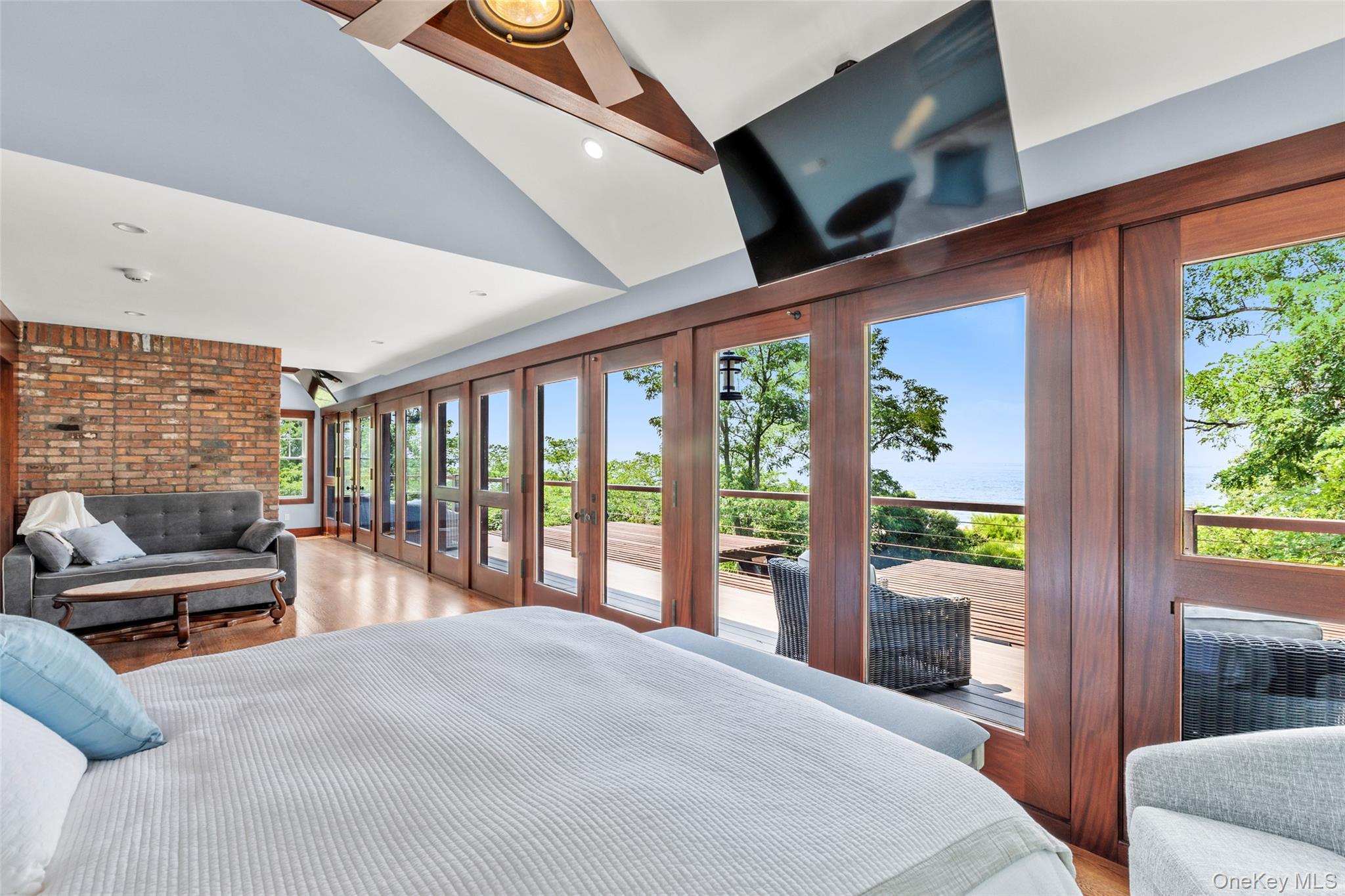 16 Old Field Woods Road Setauket, NY 11733 - Photo 21 of 37 a bedroom with furniture and large windows