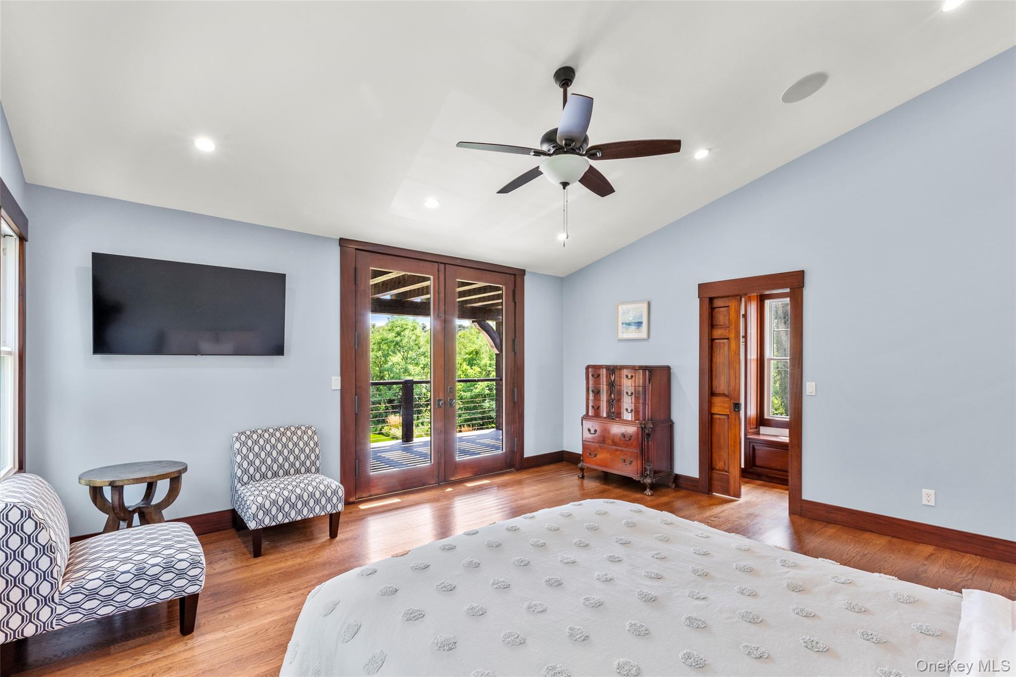 16 Old Field Woods Road Setauket, NY 11733 - Photo 31 of 37 a living room with furniture and a flat screen tv
