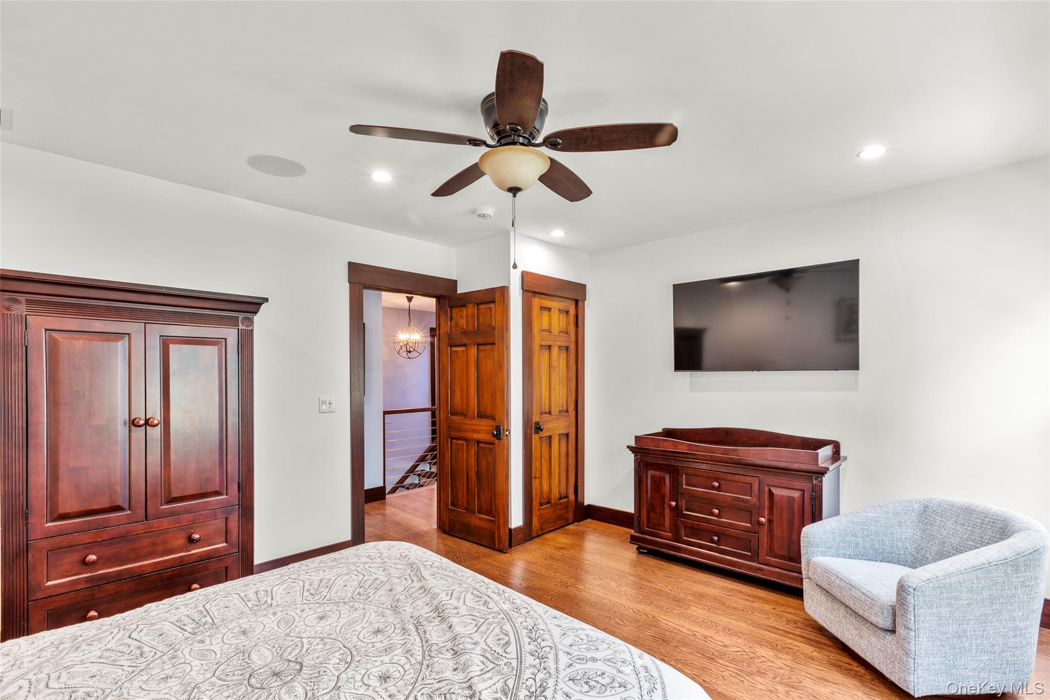 16 Old Field Woods Road Setauket, NY 11733 - Photo 33 of 37 a living room with furniture and a flat screen tv