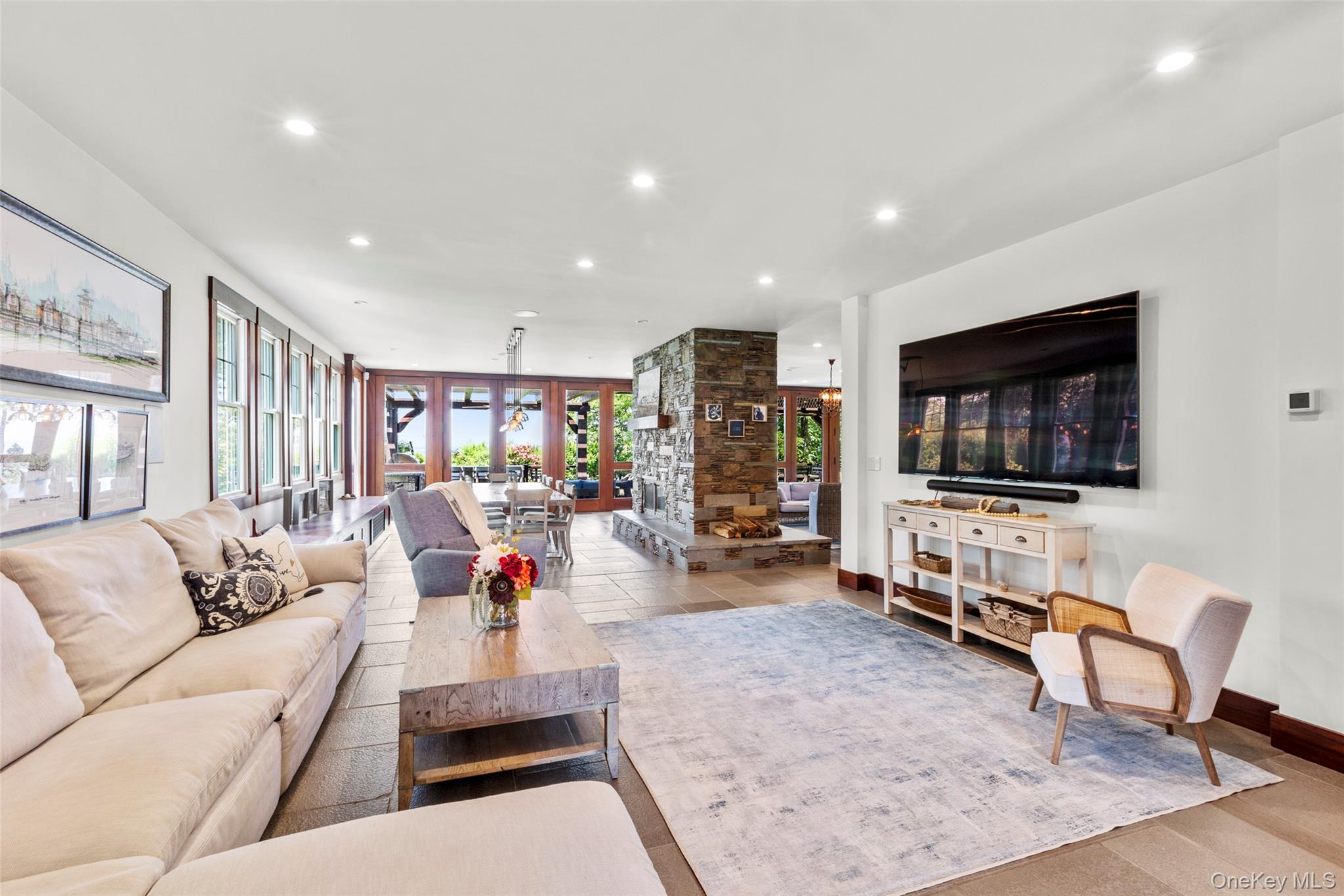 16 Old Field Woods Road Setauket, NY 11733 - Photo 5 of 37 a living room with furniture and a flat screen tv