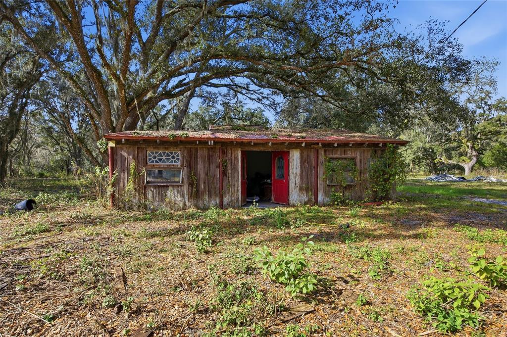 12454 Browns Berry Road Dover, FL 33527 - Photo 15 of 17 a front view of a house with a garden