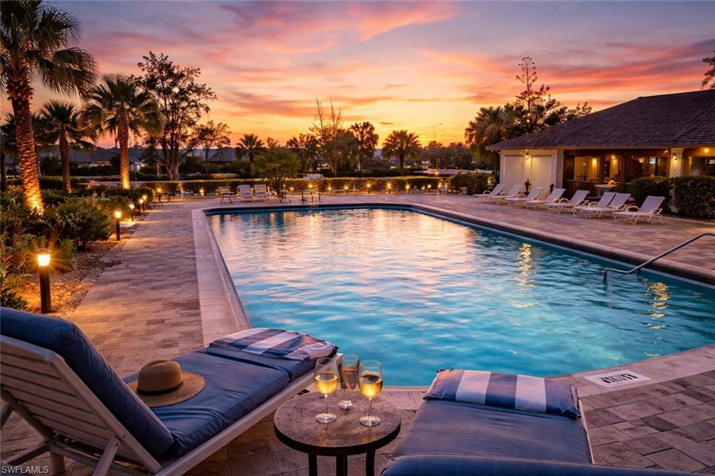 17455 Silver Fox Drive, Unit B Fort Myers, FL 33908 - Photo 1 of 19 Pool at dusk with a patio and a community pool