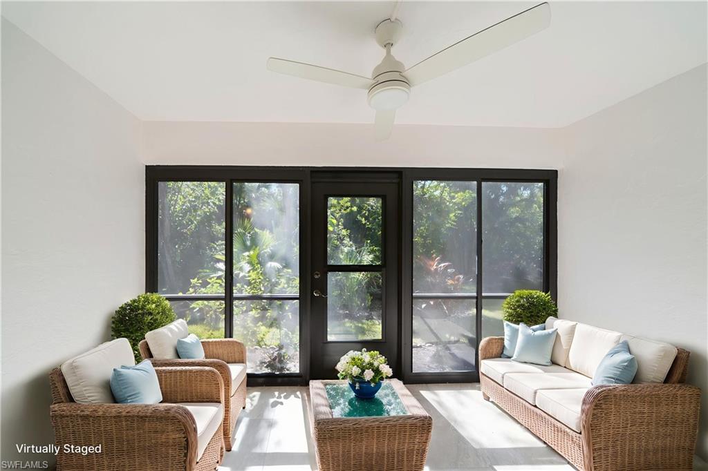 17455 Silver Fox Drive, Unit B Fort Myers, FL 33908 - Photo 8 of 19 Sunroom / solarium with an outdoor living space, healthy amount of natural light, a ceiling fan, and wood finished floors