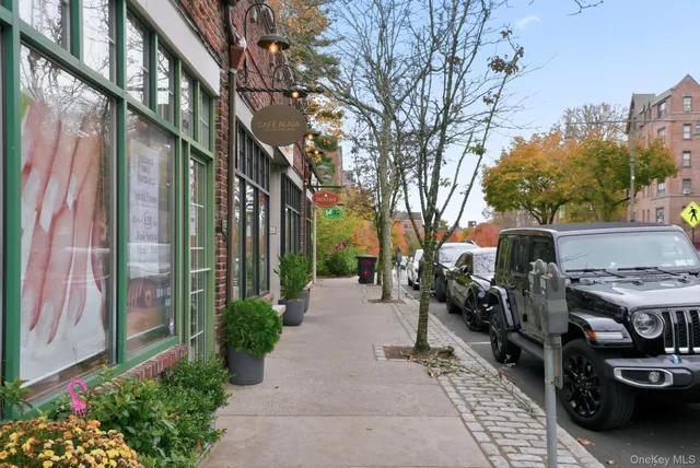 a pathway of a house with a yard