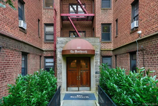 a front view of a house with a garage