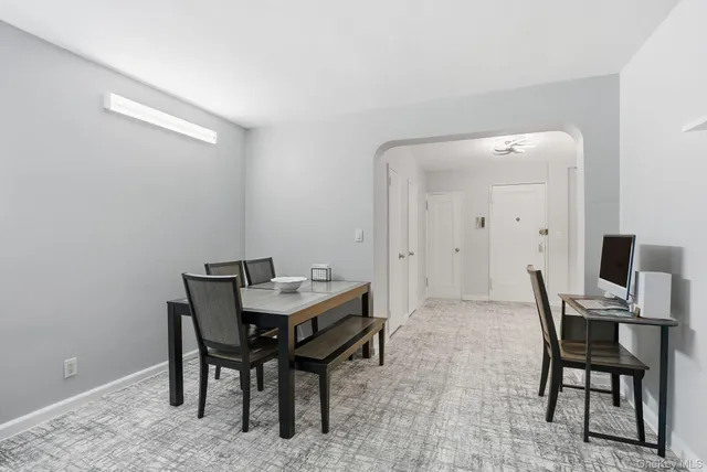 a view of a workspace with furniture