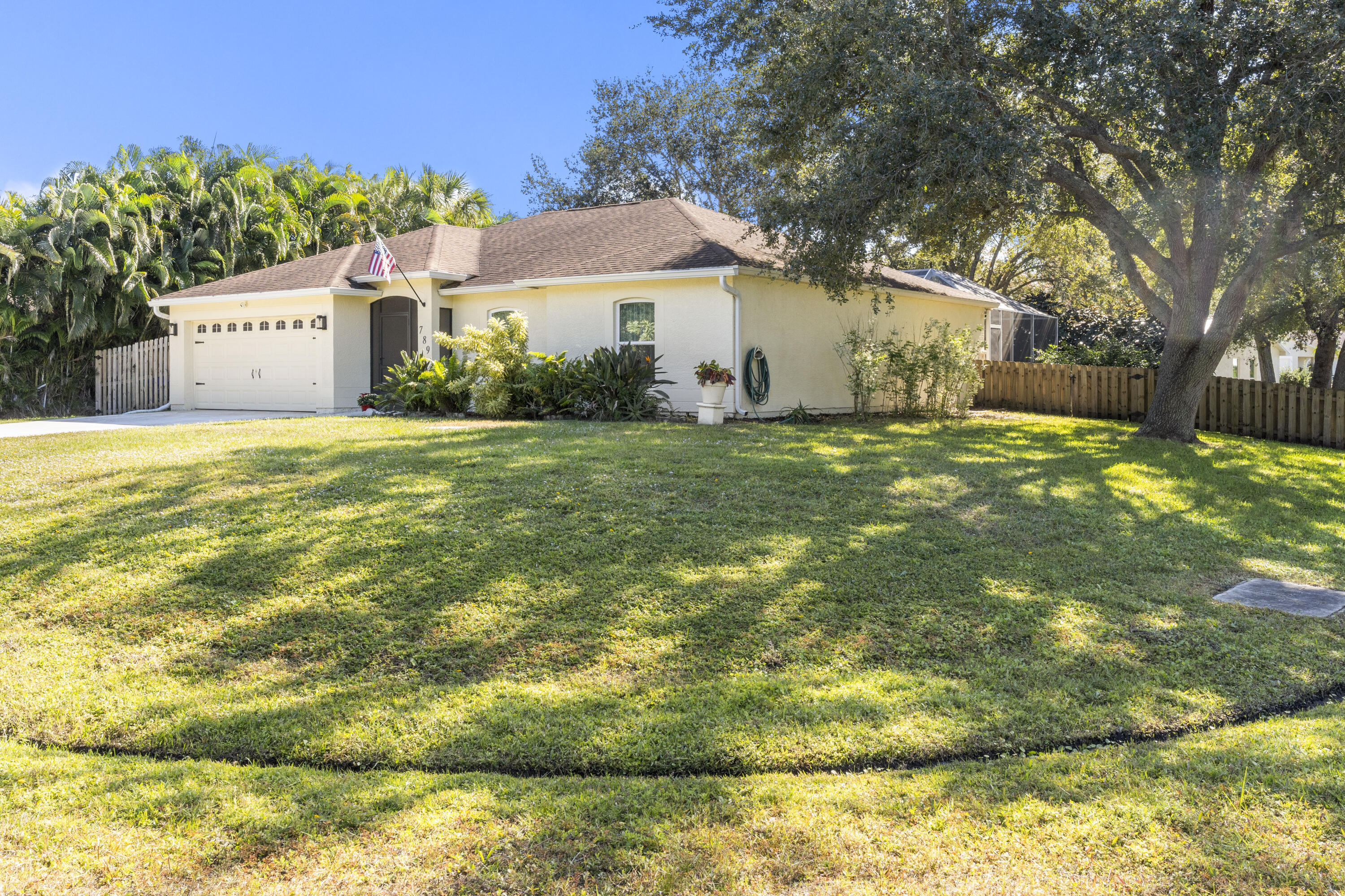 a view of a house with a yard and garage
