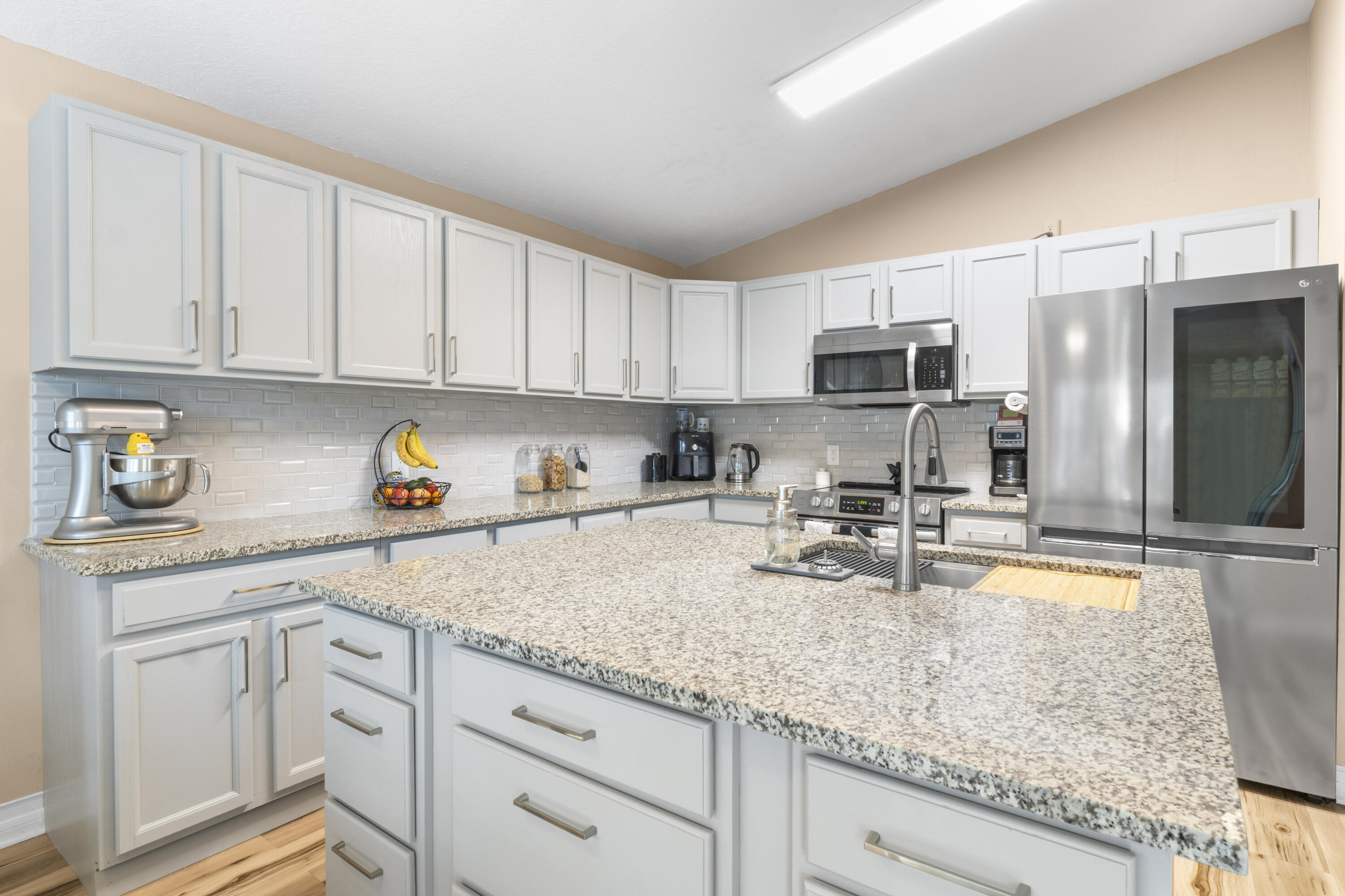 789 Vocelle Avenue Sebastian, FL 32958 - Photo 12 of 37 a kitchen with sink cabinets and microwave