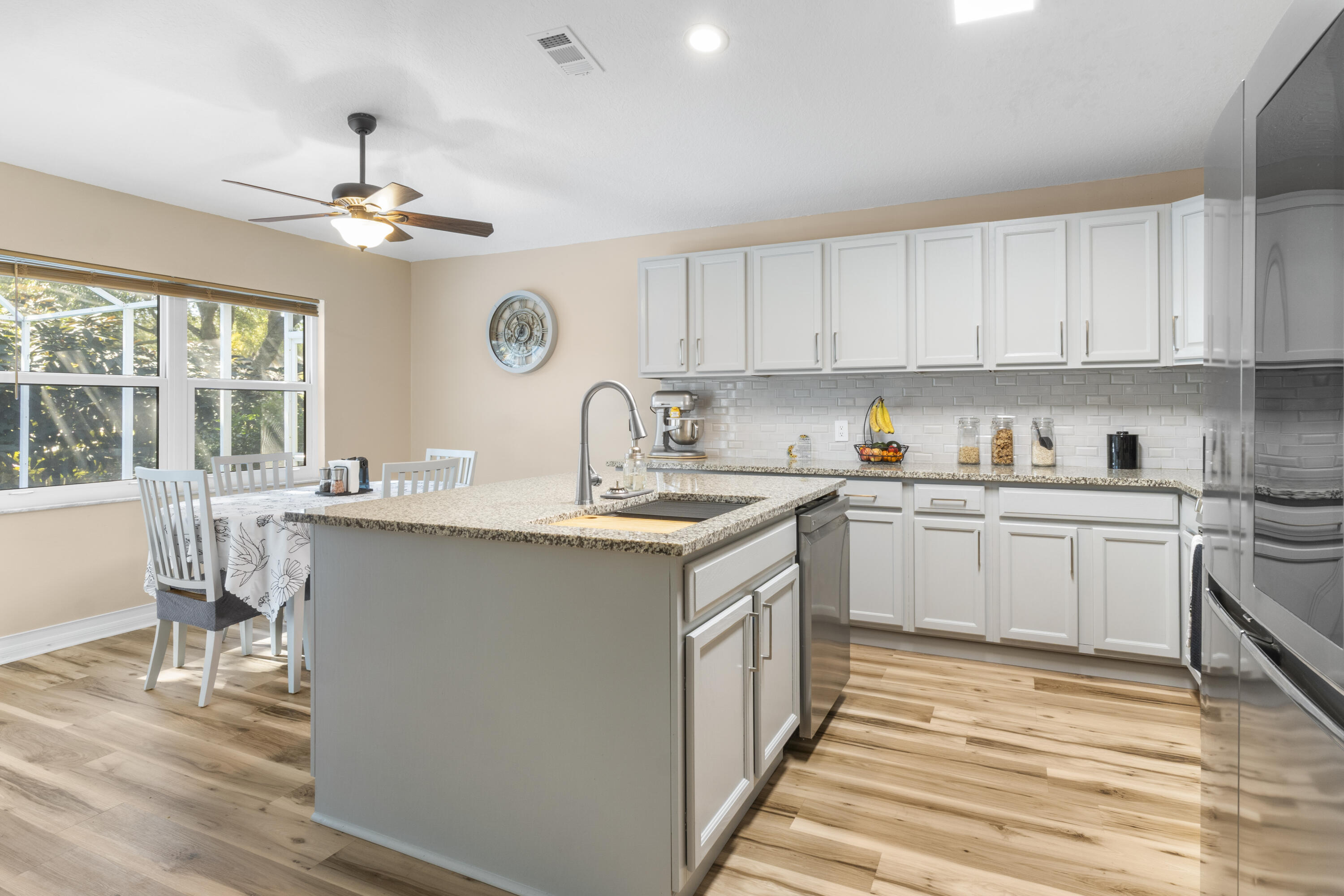 789 Vocelle Avenue Sebastian, FL 32958 - Photo 13 of 37 a kitchen with a sink cabinets and window