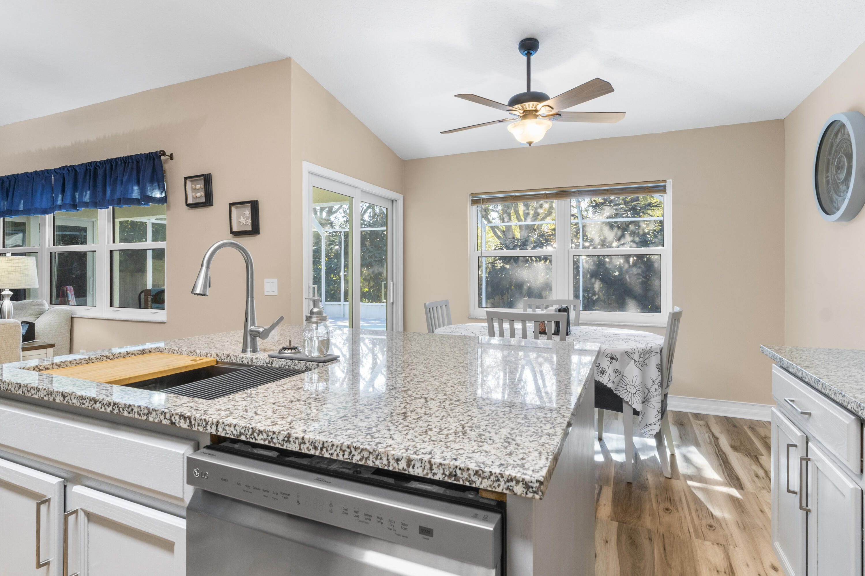 789 Vocelle Avenue Sebastian, FL 32958 - Photo 15 of 37 a kitchen with granite countertop a sink and stove
