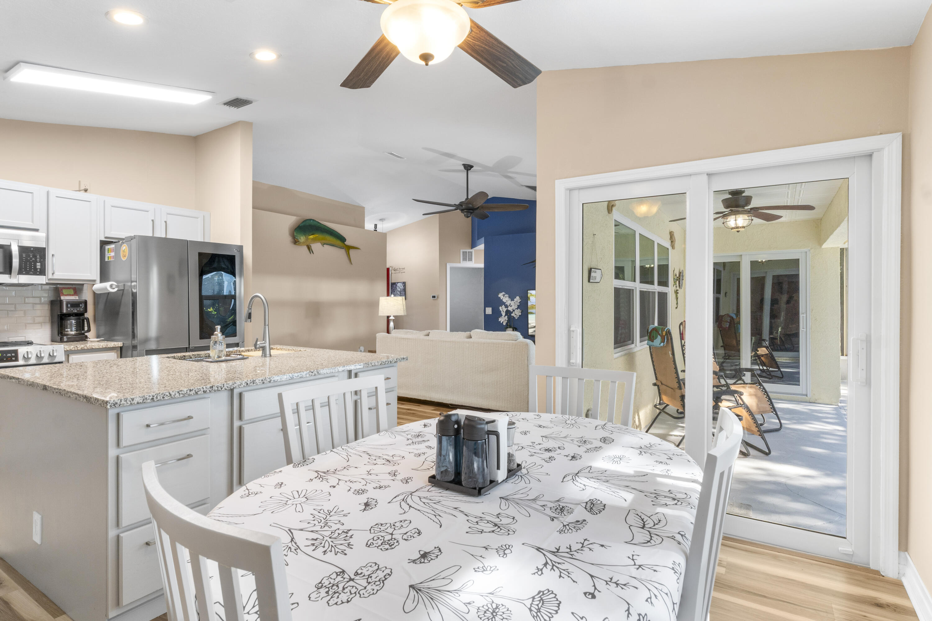 789 Vocelle Avenue Sebastian, FL 32958 - Photo 16 of 37 a kitchen with stainless steel appliances kitchen island granite countertop a sink and cabinets