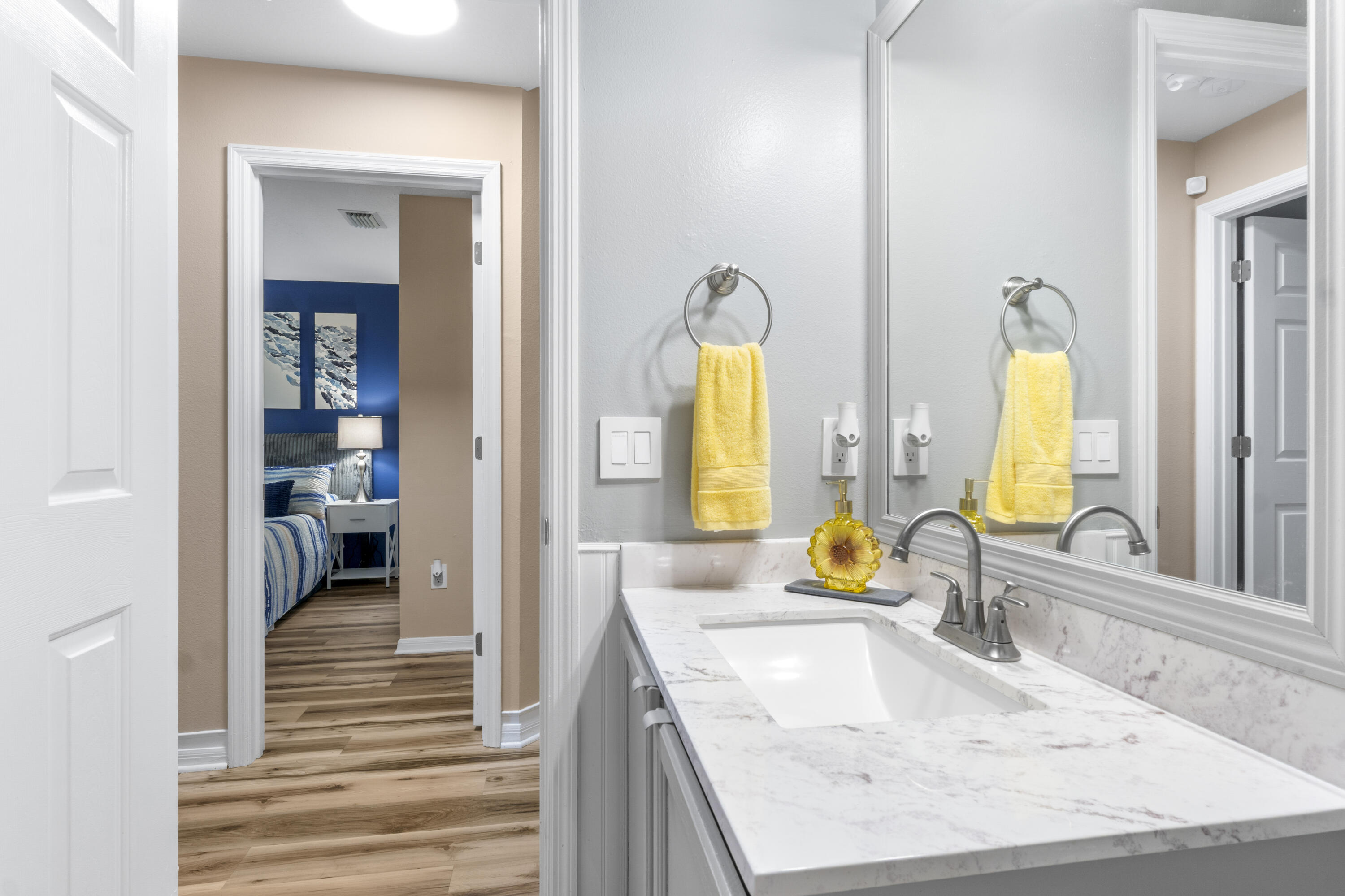 789 Vocelle Avenue Sebastian, FL 32958 - Photo 24 of 37 a bathroom with a granite countertop sink and a mirror