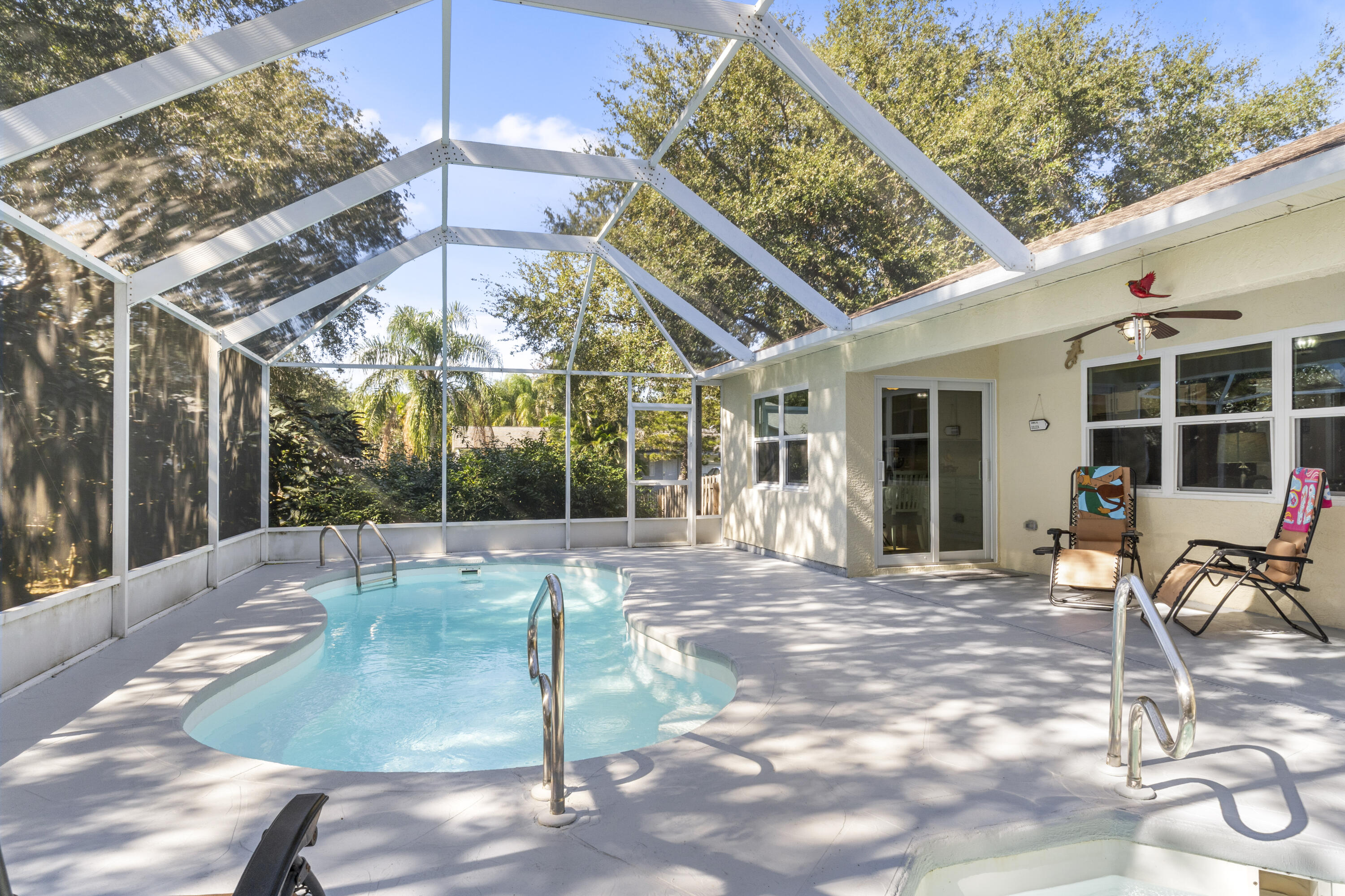 789 Vocelle Avenue Sebastian, FL 32958 - Photo 31 of 37 a patio with a table and chairs