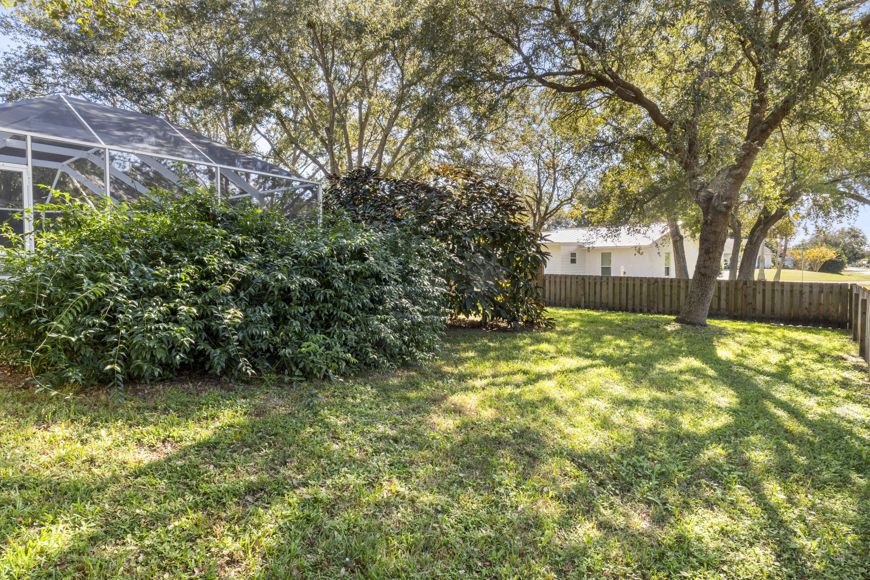 789 Vocelle Avenue Sebastian, FL 32958 - Photo 35 of 37 a view of a yard with plants and trees