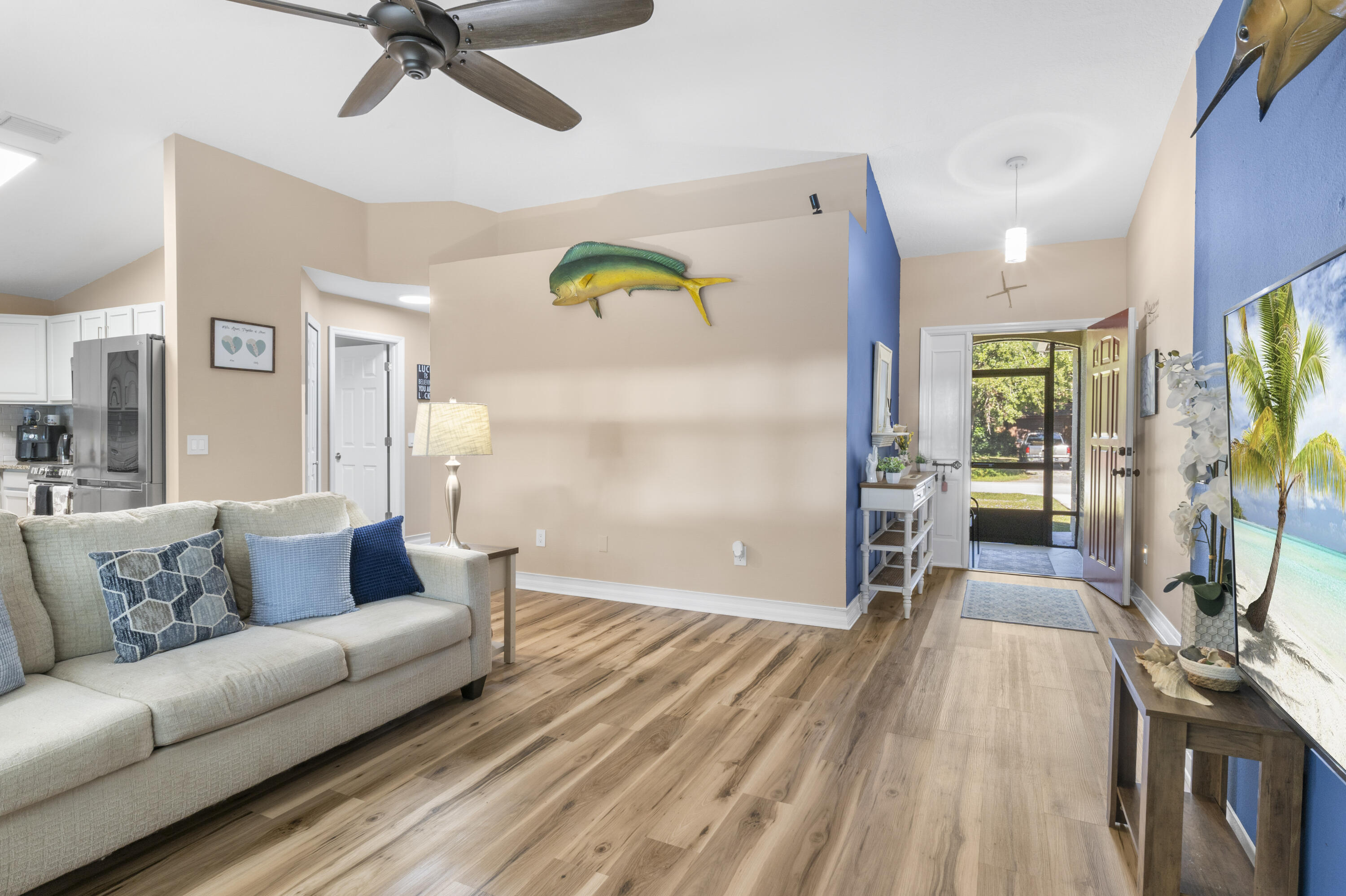 789 Vocelle Avenue Sebastian, FL 32958 - Photo 7 of 37 a living room with furniture and a wooden floor