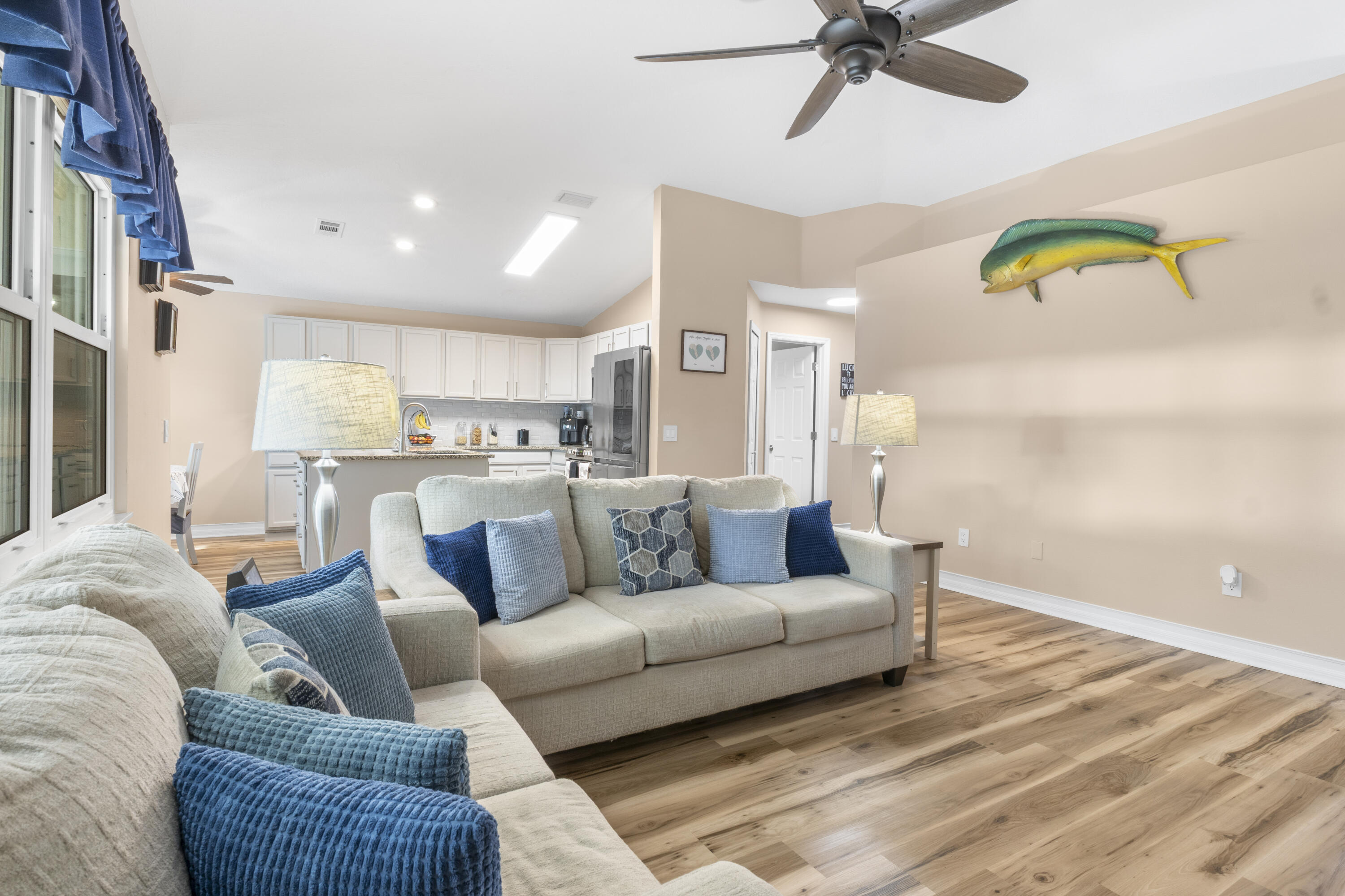 789 Vocelle Avenue Sebastian, FL 32958 - Photo 9 of 37 a large living room with stainless steel appliances furniture and a window