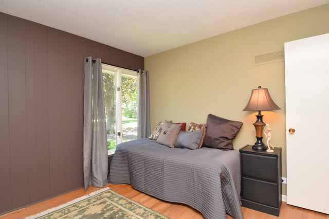 136 Fairway Lane Wheaton, IL 60189 - Photo 14 of 22 a bedroom with a bed and a window