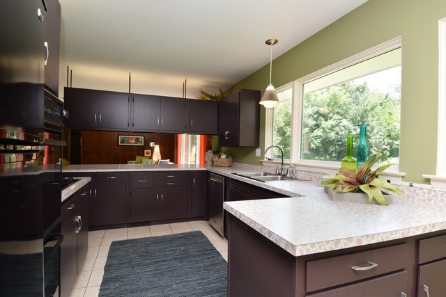 136 Fairway Lane Wheaton, IL 60189 - Photo 5 of 22 a kitchen with a sink a counter top space and living room view