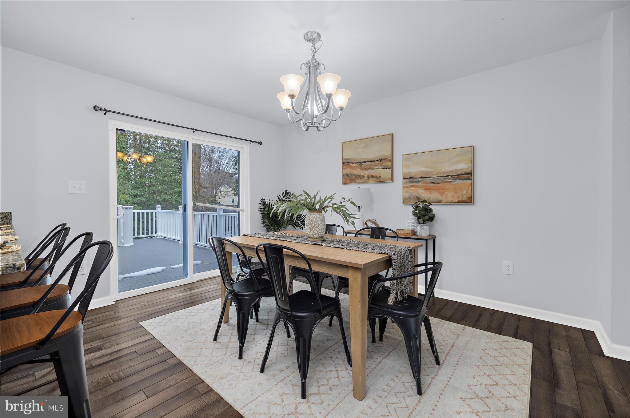 3009 Noahs Way Pasadena, MD 21122 - Photo 12 of 44 a view of a dining room with furniture window and wooden floor