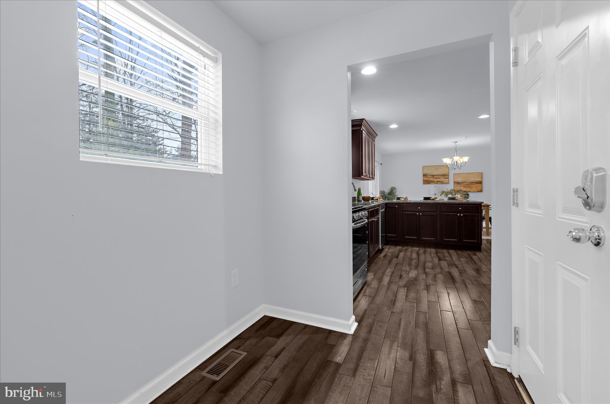 3009 Noahs Way Pasadena, MD 21122 - Photo 16 of 44 a view of a kitchen from a hallway