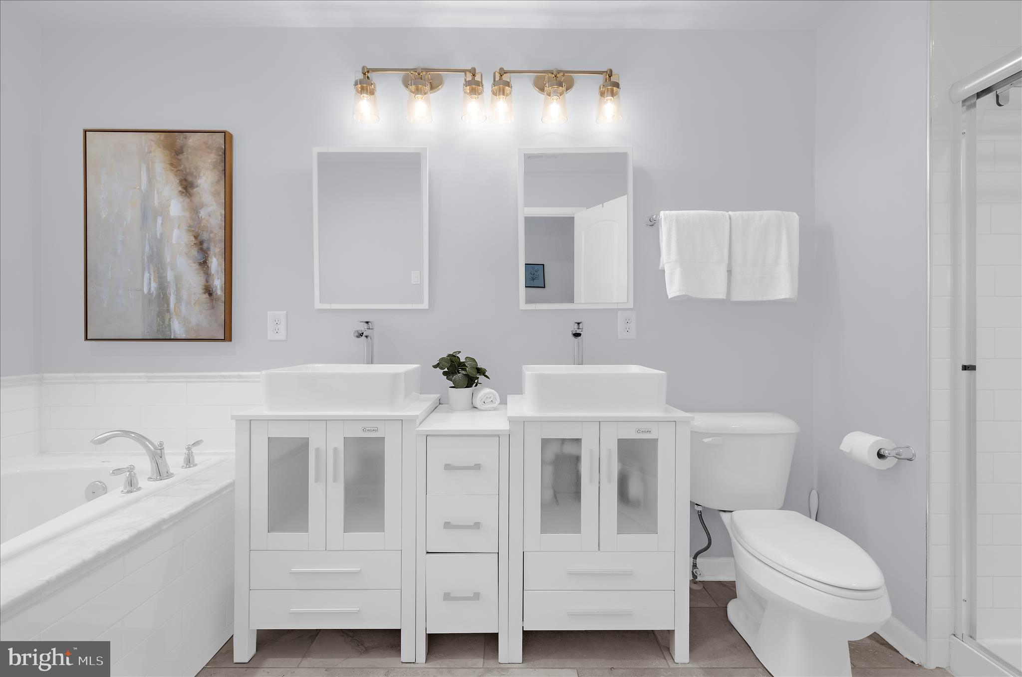 3009 Noahs Way Pasadena, MD 21122 - Photo 21 of 44 a bathroom with a toilet sink and mirror