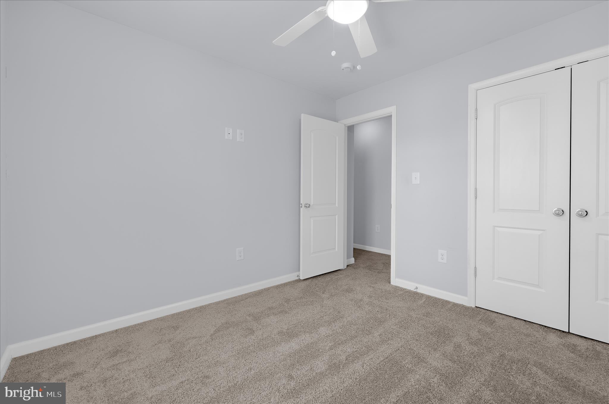 3009 Noahs Way Pasadena, MD 21122 - Photo 34 of 44 an empty room with a ceiling fan